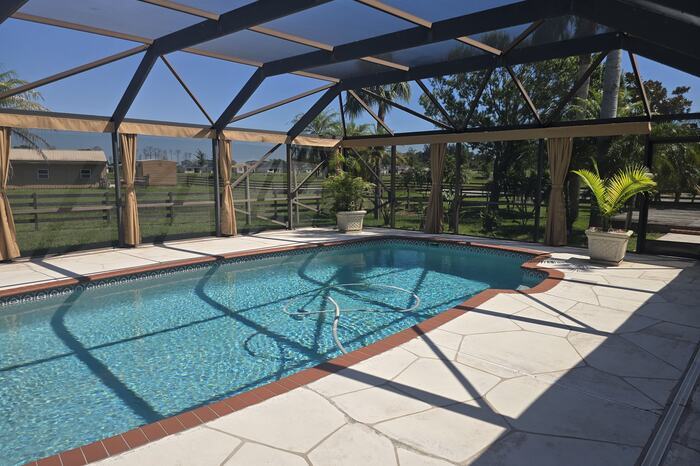 Screened residential pool in Palm Bay, FL on weekly pool service