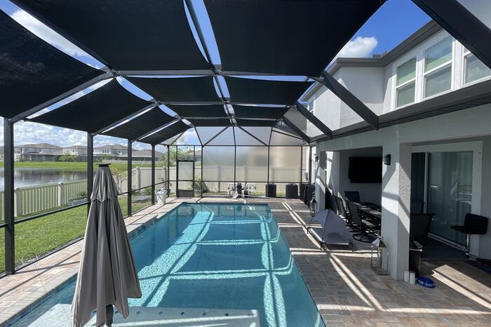 Newer screened pool at a two-story home in West Melbourne, FL