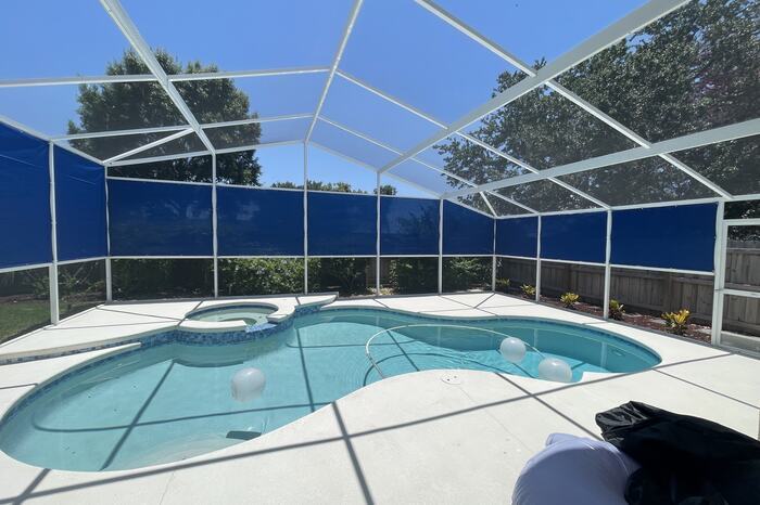 Screened pool and spa off Wickham Road in Melbourne, FL